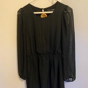 Cute and modest black dress with pleated breast